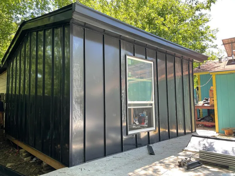 Black standing seam metal wall panels for Roof Inspection in Rosaryville